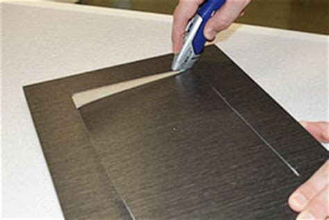 Another awesome renter friendly hack. Peel and Stick Laminate - Peel and Stick Cabinets