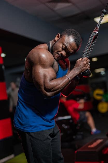 Premium Photo Weight Training African Doing Bodybuilding In Gym