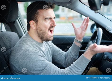 Face Expression Of Angry Driver Arguing And Gesturing Stock Photo