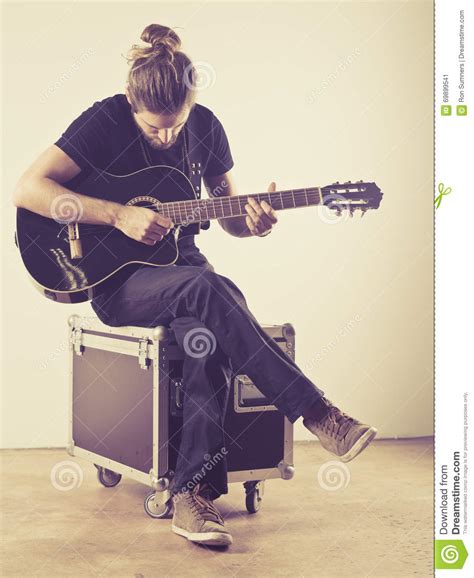 Young Man Sitting And Playing Guitar Stock Image Image Of Young