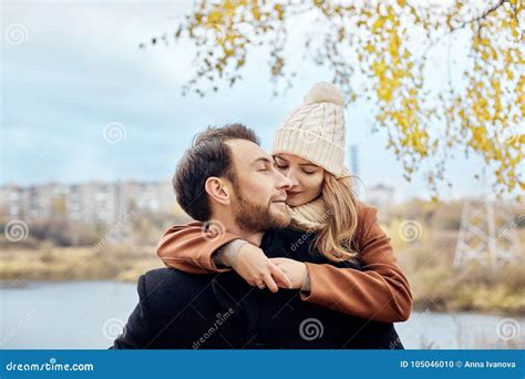 Loving Couple Walking In Park In Autumn Hugs And Kisses Autumn Stock