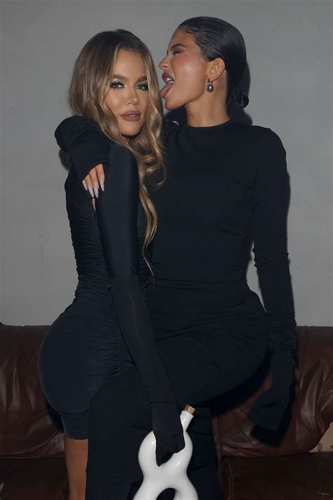 kylie jenner licks khloe kardashian s face as sisters show off thin waists in matching tight