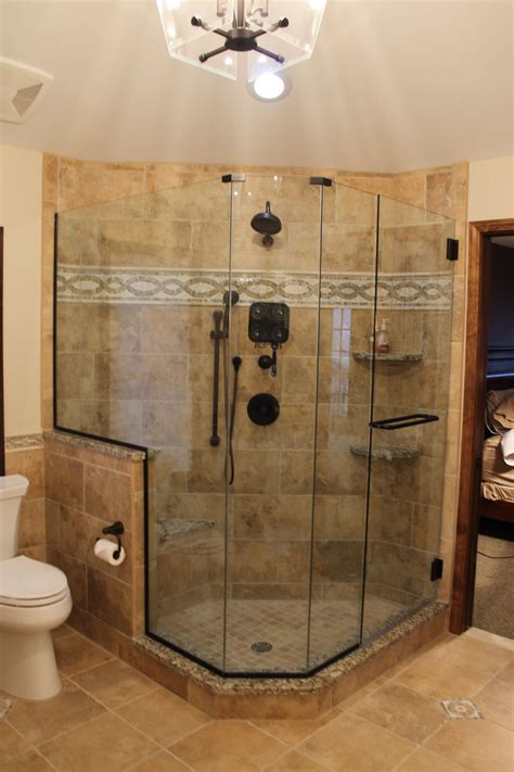 Custom Tiled Shower With Accent Tile Strip Roman Bronze Fixtures