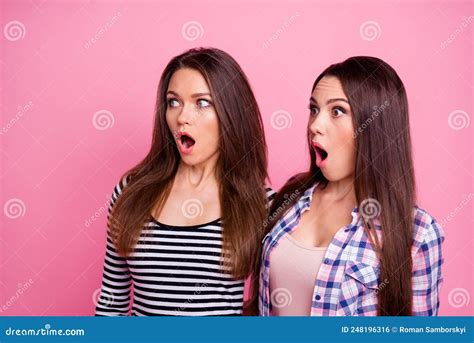Photo Of Two Shocked Impressed Pretty Girls Open Mouth Look Empty Space Isolated On Pink Color
