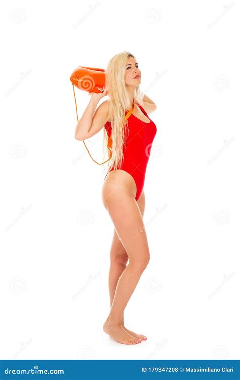 Pretty Young Blonde Lifeguard In Red Swimsuit With Lifeguard Rescue Can Floating Buoy TubeÂ On