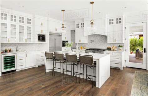 Beautiful White Kitchen In New Luxury Home With Waterfall Island