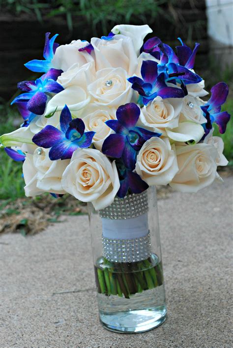 Turquoise purple rose orchid bridal wedding bouquet & boutonniere. Blue Orchid wedding bouquet. Blue and purple orchids ...