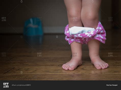 Little Girl With Her Training Underpants Around Her Legs Stock Photo