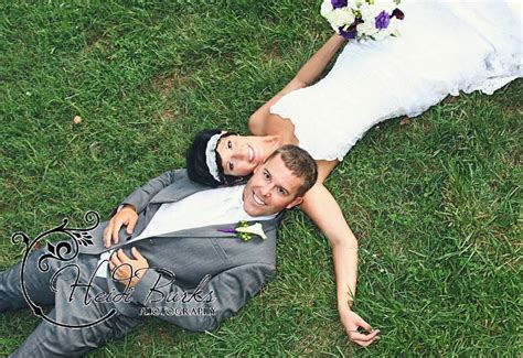 Bride And Groom Laying In Grass Wedding Pose Heidi Burks Photography