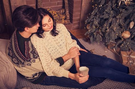 Premium Photo Beautiful Brunette Caucasian Romantic Loving Couple In Cozy Warm Sweaters In The