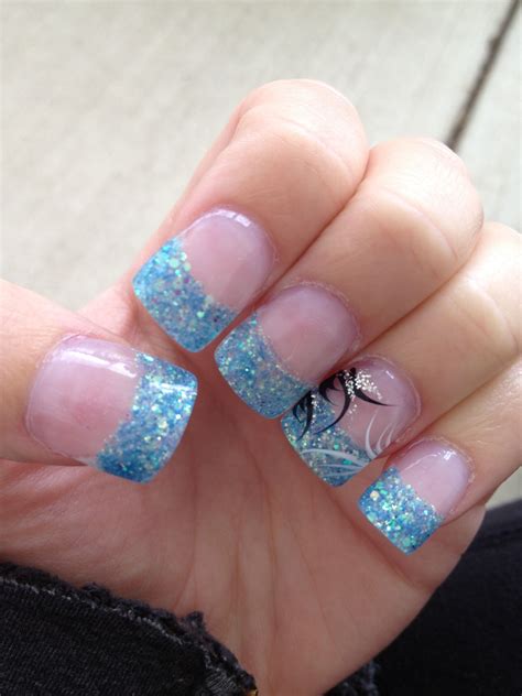 Thinking of adding some sparkles on your next mani? Light blue sparkle gel tips with black white and silver ...