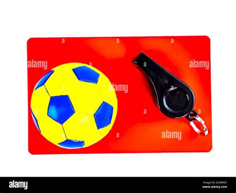 Soccer Ball And Red Card With The Whistle Of A Soccer Referee On A