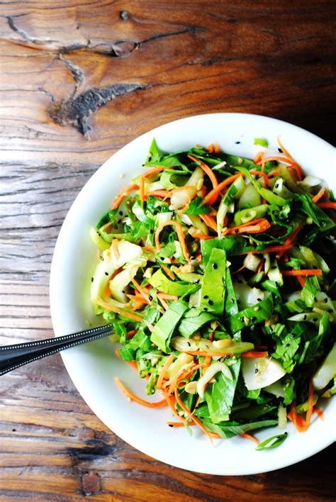 bok choy salad with garlic sesame dressing white plate blank slate