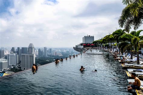 Guests staying in rooms facing the city will love the stunning view of singapore's cityscapes, while guests on the other side will be treated to the beautiful view of singapore's skyline against the. Infinity Pool at Marina Bay Sands Singapore | Infinity ...