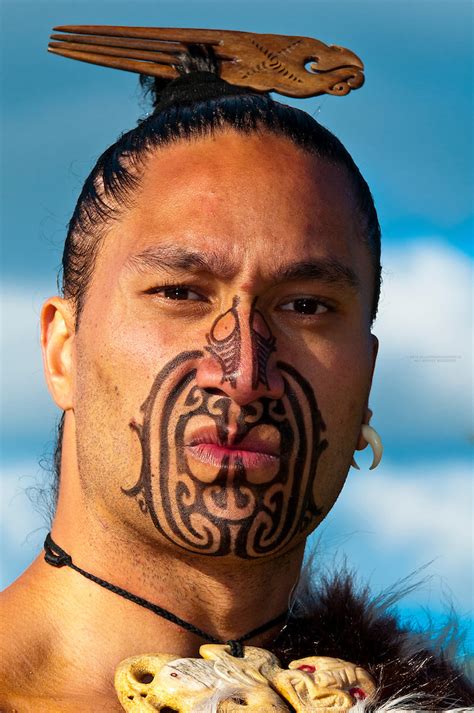 A Maori Warrior With A Ta Moko Facial Tattoo Performs A War Haka Dance Te Puia New Zealand