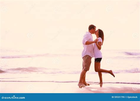 Romantic Couple Kissing On The Beach At Sunset Stock Image Image Of