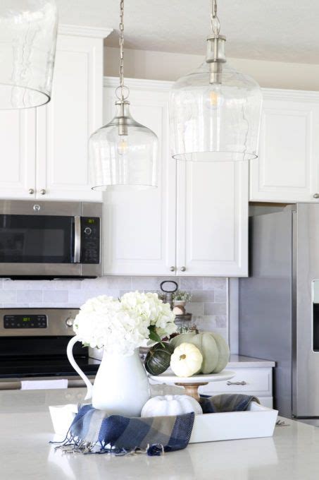 How big should an island light be. Our Big Light Swap | Glass pendants kitchen, White kitchen ...