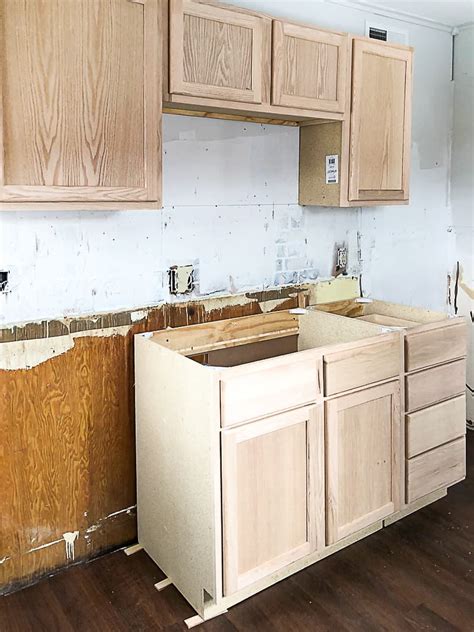 Learn about the features of unfinished kitchen cabinets to see how this affordable option can give you unique and beautiful cabinets on a budget. Unfinished Wood Cabinets To Make The Flip House Kitchen ...
