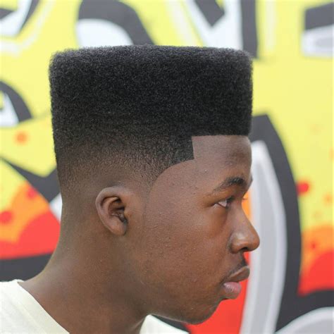 The under shave and gorgeous braids swept to the front are a bold and edgy look meant for a fierce and stylish man. nice haircuts for black man, top haircuts for black man ...