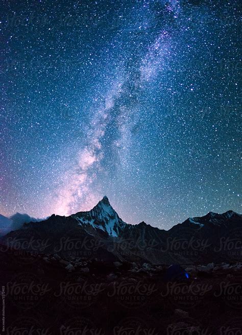 Milky Way On A Night Sky Over The Mountains By Ibexmedia