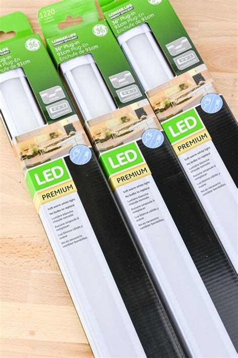 Even with the brightest overhead lights, wall cabinets can super rechargeable: Introducing Under Cabinet Lighting by Jasco: See our DIY!