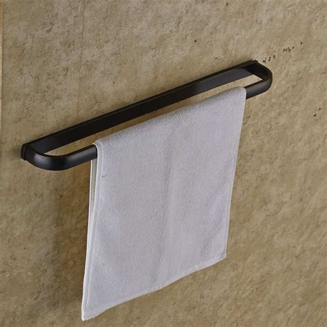 I have a small bathroom and what i did i bought a metal wine rack and hung it above the toilet, i fold my towels length wise in thirds and then roll the towel and place it in the cubby, then i found 2 hooks. 17 Best Bathroom Towel Rack Ideas and Towel Hangers for ...