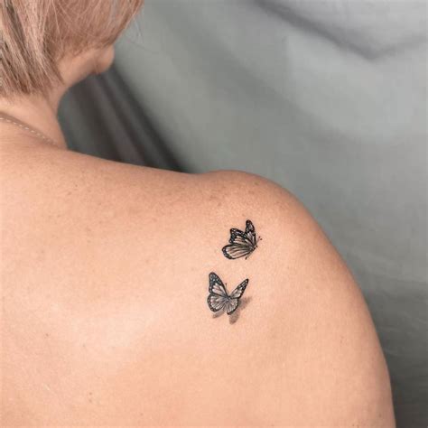 Fine Line Butterflies Tattoo On The Shoulder Blade