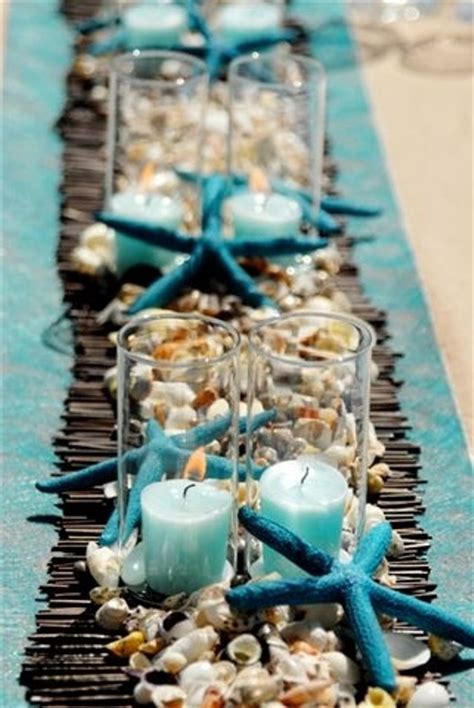 See more ideas about beach themes, wedding centerpieces, beach theme wedding. Picture Of a bamboo runner, seashells and pebbles ...