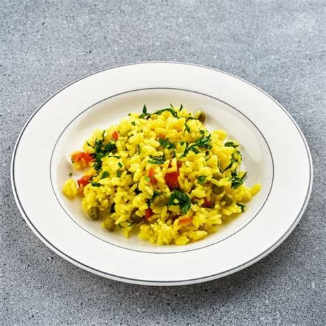 Rice With Turmeric And Green Peas Photos By Canva