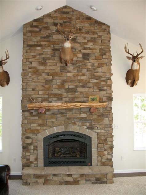 If you love rustic decor then you are in for a real treat with this mountaintop mansion tour. rustic stack stone fireplaces for lodge