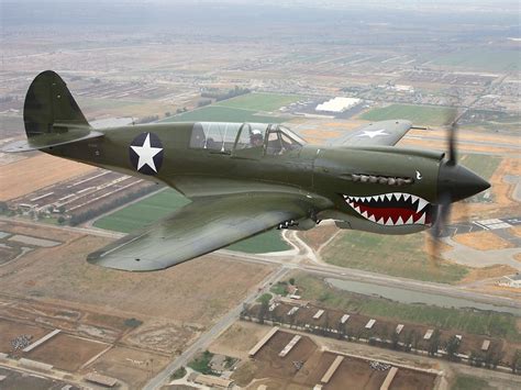 A Curtiss P 40 Warhawk In Flying Tiger Livery Aircraft Art Wwii