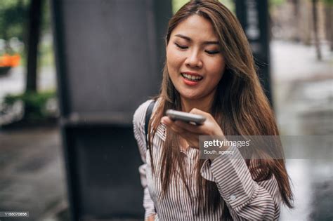 Beautiful Woman Using Mobile Phone High Res Stock Photo Getty Images