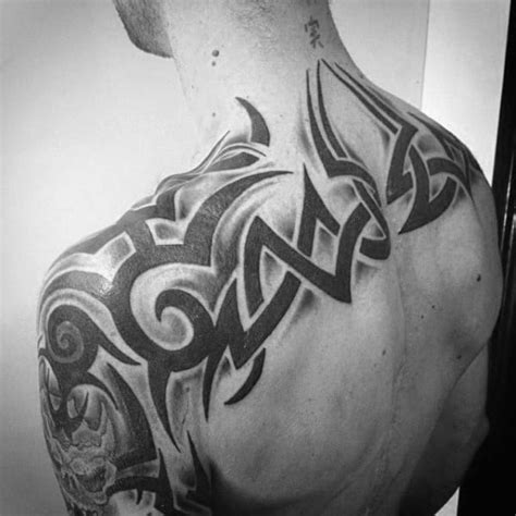 This is a perfect canvas for the masters and lovers of large, complex compositions. 60 Tribal Back Tattoos For Men - Bold Masculine Designs