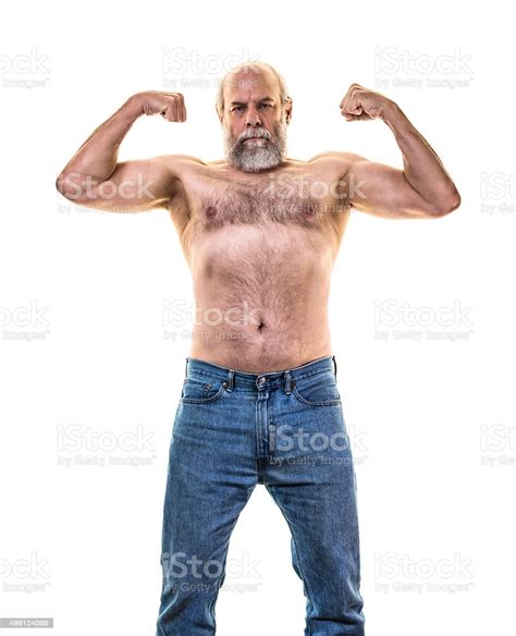 Senior Adult Man Flexing Arm And Upper Body Muscles Stock