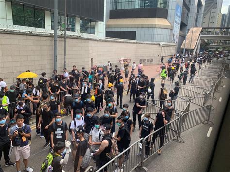 hong kong protesters surround police headquarters amid heat warning