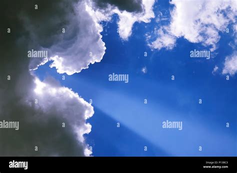 Sun Rays Through Clouds Stock Photo Alamy