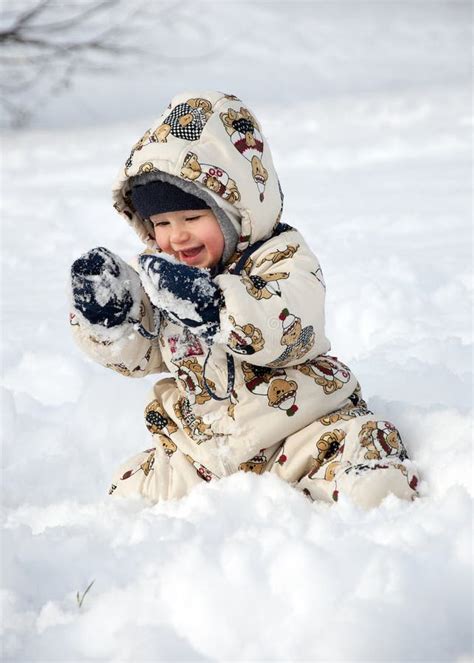 Happy Baby In Snow Stock Photos Image 12368483