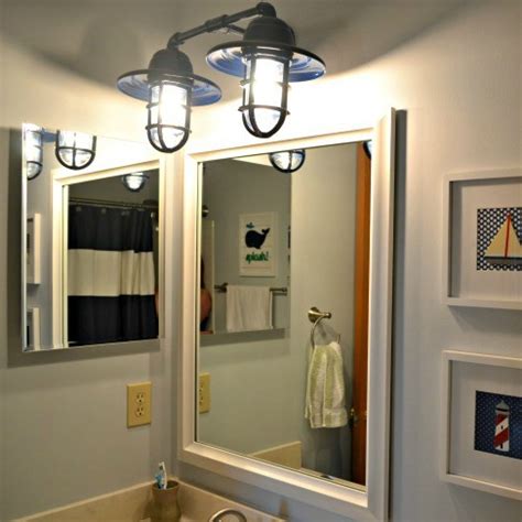 The vanity needed a lighter look to fit in with the planned beachy theme of the bathroom. 10 Bathroom Vanity Lighting Ideas - The Cards We Drew