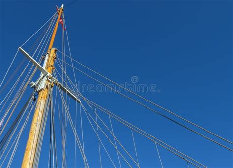 Sailing Ship Mast Against The Blue Sky On Some Sailing Boats With