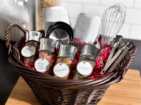 The housewarming basket contains cookies, cheese spread, crackers, stone ground mustard, a bamboo cutting board and even a cheese knife! Photos | HGTV