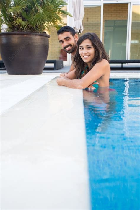 Beautiful Couple Having Fun In Swimming Pool Photo Background And Picture For Free Download