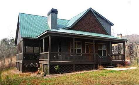 Multiple cabin plans by north dakota state university Small 2 Story 3 bedroom cabin with wraparound porch ...