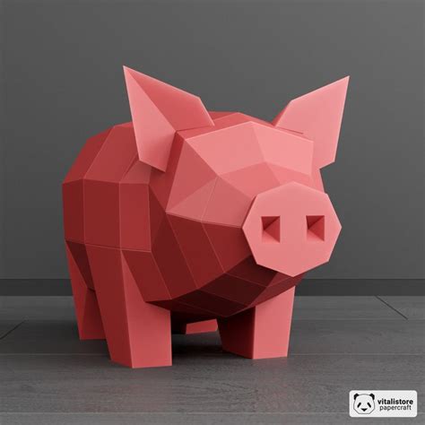 An Origami Pig Is Shown On The Floor In Front Of A Gray Wall