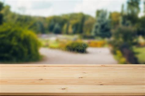 Wooden Board Empty Table In Front Of A Blurred Background Perspective