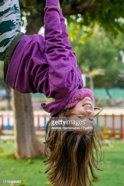 Girl Hanging Upside Down In A Playground Photos And Premium High Res Pictures Getty Images