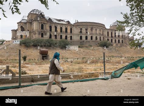 Afghan Man Walking By The Ruins Of Darul Aman Palace Kabul