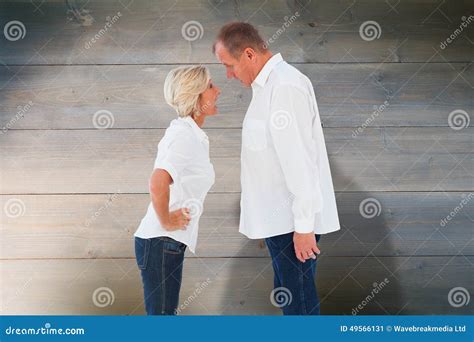 Composite Image Of Angry Older Couple Arguing With Each Other Stock