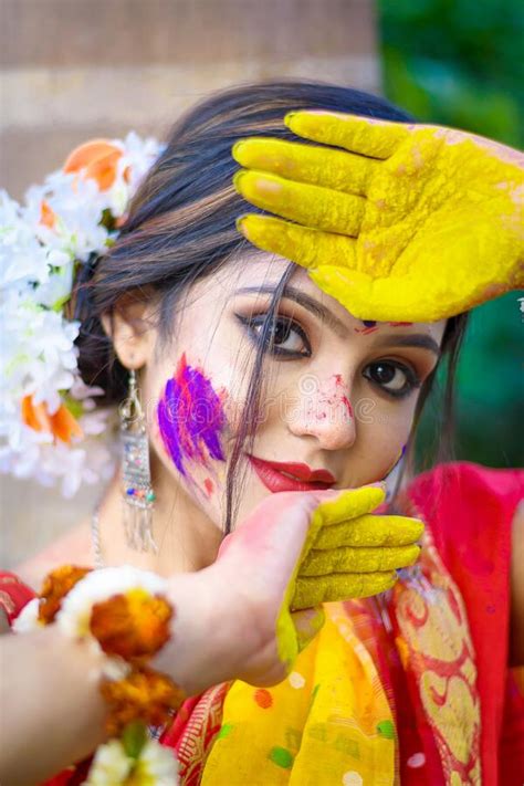 Pretty Young Indian Girl Showing Colourful Palm And Celebrating Holi