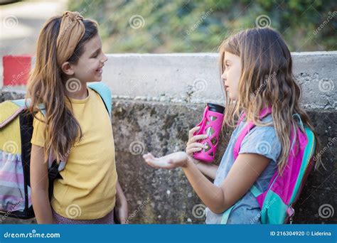 Two Little Girls Talking And Standing Outside Stock Photo Image Of