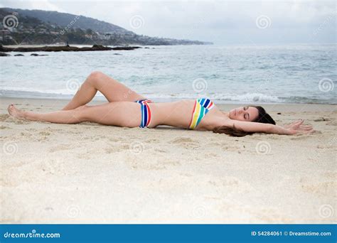Beautiful Woman In Cute Bikini Lying On The Sand At Beach Stock Photo Image